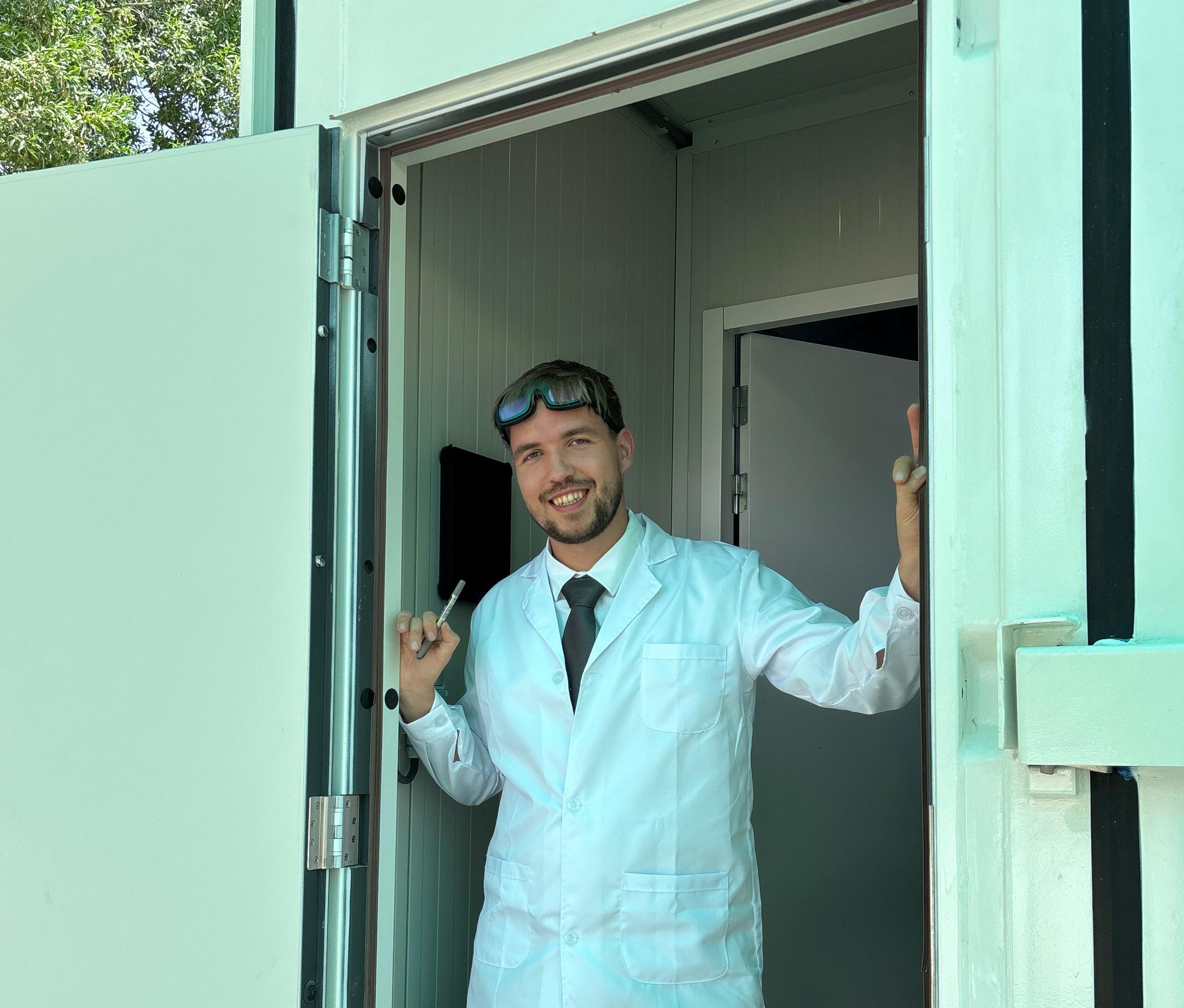 Ilia Sukhodolov reviewing crops inside a hydroponic greenhouse